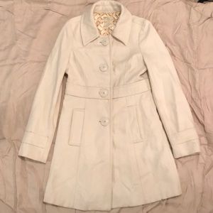 Cream pea coat from the classic bran Tulle.